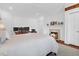 Cozy bedroom featuring a king-size bed, a fireplace, and a desk, perfect for relaxation and productivity at 8 & 8 1/2 Elliott St # 8 & 8 1/2, Charleston, SC 29401