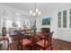 Formal dining area with a fireplace, built-in shelves, and seating for four at 8 & 8 1/2 Elliott St # 8 & 8 1/2, Charleston, SC 29401