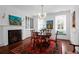 Elegant dining room showcases a decorative fireplace, a wooden table, and a lovely window seat at 8 & 8 1/2 Elliott St # 8 & 8 1/2, Charleston, SC 29401