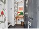 Inviting entryway with unique wallpaper, stylish mirror, and warm lighting for a welcoming ambiance at 8 & 8 1/2 Elliott St # 8 & 8 1/2, Charleston, SC 29401