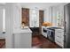 Elegant kitchen featuring white countertops, exposed brick, and stainless steel appliances at 8 & 8 1/2 Elliott St # 8 & 8 1/2, Charleston, SC 29401