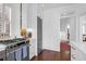 Cozy kitchen featuring stainless steel appliances, white cabinets, and a view to the living room at 8 & 8 1/2 Elliott St # 8 & 8 1/2, Charleston, SC 29401