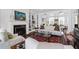 Bright living room features white walls, a fireplace, and a comfortable sofa with colorful pillows at 8 & 8 1/2 Elliott St # 8 & 8 1/2, Charleston, SC 29401