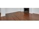 Spacious living area featuring gleaming hardwood floors and a cozy fireplace at 8 & 8 1/2 Elliott St # 8 & 8 1/2, Charleston, SC 29401