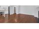 Bright living space with hardwood floors, white trim, and updated kitchen appliances at 8 & 8 1/2 Elliott St # 8 & 8 1/2, Charleston, SC 29401