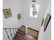 Staircase with wooden steps, black metal railings, and decorative artwork at 8 & 8 1/2 Elliott St # 8 & 8 1/2, Charleston, SC 29401