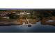 Aerial view of a dock extending into tranquil waters, surrounded by lush marshland at 810 Curved Creek Ct, James Island, SC 29412