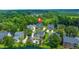 Picturesque aerial view of a residential neighborhood featuring a swimming pool and tranquil pond at 8605 Refuge Point Cir, North Charleston, SC 29420