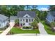 An aerial view shows the home's landscaped yard, two-car garage, and surrounding neighborhood at 8605 Refuge Point Cir, North Charleston, SC 29420