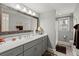 Bathroom featuring a wide mirror, vanity with lamps, and modern fixtures and decor at 8605 Refuge Point Cir, North Charleston, SC 29420