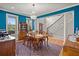 Dining room with elegant chandelier, wooden furniture, and staircase access at 8605 Refuge Point Cir, North Charleston, SC 29420