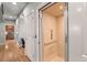 Hallway view featuring an elevator with wood paneled interior, and access to the kitchen at 8605 Refuge Point Cir, North Charleston, SC 29420
