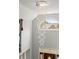 A decorative chandelier hangs above the front door and staircase in this shot of the foyer at 8605 Refuge Point Cir, North Charleston, SC 29420