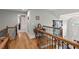 Hallway showcasing hardwood floors and wrought iron railings provides access to additional rooms in the home at 8605 Refuge Point Cir, North Charleston, SC 29420
