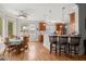 Bright kitchen features wooden cabinets, granite countertops, stainless steel appliances, and a cozy breakfast nook at 8605 Refuge Point Cir, North Charleston, SC 29420