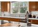 Modern kitchen with granite countertops, stainless steel appliances, wooden cabinets and great natural light at 8605 Refuge Point Cir, North Charleston, SC 29420