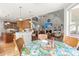 Open floor plan showcasing the kitchen, breakfast nook, and living room with fireplace and built-in shelving at 8605 Refuge Point Cir, North Charleston, SC 29420