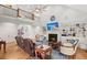 Spacious living room with a cozy fireplace, soaring ceilings, and a second-story balcony overlooking at 8605 Refuge Point Cir, North Charleston, SC 29420