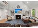 Cozy living room featuring a fireplace, hardwood floors, and comfortable seating at 8605 Refuge Point Cir, North Charleston, SC 29420