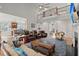 Open-concept living room with hardwood floors, high ceilings, and balcony access at 8605 Refuge Point Cir, North Charleston, SC 29420