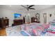 Bedroom featuring wood floors, rug, wooden furniture, and bright windows with natural light at 8605 Refuge Point Cir, North Charleston, SC 29420