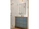 Beautiful bathroom featuring a shower and a blue vanity with a gold faucet and modern square mirror at 926 Pitt St, Mount Pleasant, SC 29464