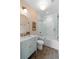 Bathroom featuring a shower over tub, tiled walls, stylish vanity, and geometric flooring at 926 Pitt St, Mount Pleasant, SC 29464