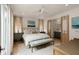Calming bedroom features a comfy bed, stylish bench, and ensuite bathroom access at 926 Pitt St, Mount Pleasant, SC 29464