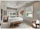 Light-filled bedroom features two windows, a ceiling fan, and a patterned rug at 926 Pitt St, Mount Pleasant, SC 29464