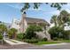 Beautiful house featuring a brick chimney and lush landscaping at 926 Pitt St, Mount Pleasant, SC 29464