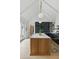 Elegant kitchen with vaulted ceiling, marble island, and chef's kitchen appliances at 926 Pitt St, Mount Pleasant, SC 29464