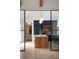 Open-concept kitchen with marble countertops, stainless steel appliances, and glass partition at 926 Pitt St, Mount Pleasant, SC 29464