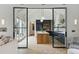 Open concept kitchen with a central island, black cabinets, and modern pendant lighting at 926 Pitt St, Mount Pleasant, SC 29464
