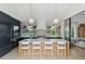 Modern kitchen features a marble island, open shelving, and professional-grade appliances at 926 Pitt St, Mount Pleasant, SC 29464