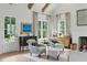Bright living room with comfortable seating, a fireplace, and views of the yard at 926 Pitt St, Mount Pleasant, SC 29464
