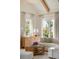 Well-lit living room showcasing natural light, a white sofa, and rattan coffee table at 926 Pitt St, Mount Pleasant, SC 29464