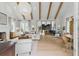 Open-concept living space with high ceilings, exposed beams, and seamless flow to the kitchen at 926 Pitt St, Mount Pleasant, SC 29464