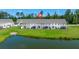 Aerial view of townhomes backing up to a pond, featuring a screened in porch at 9712 Transplanter Cir, Ladson, SC 29456