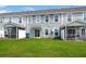 Home featuring a large backyard with lawn, patio, and screened in porch at 9712 Transplanter Cir, Ladson, SC 29456