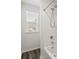Neutral bathroom featuring gray flooring, shower and tub combo, and window at 9712 Transplanter Cir, Ladson, SC 29456