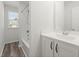 Bathroom features vanity with gray flooring, shower and tub combo, and window at 9712 Transplanter Cir, Ladson, SC 29456