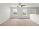 Bedroom features neutral walls, carpet, a ceiling fan, and views of the water at 9712 Transplanter Cir, Ladson, SC 29456