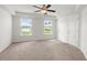 Main bedroom with neutral walls, carpet, ceiling fan, and a view of the water at 9712 Transplanter Cir, Ladson, SC 29456