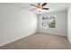 Bedroom featuring neutral walls, carpet, a ceiling fan, and a window at 9712 Transplanter Cir, Ladson, SC 29456