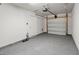 Clean garage interior with painted floors, garage door opener and access door to the house at 9712 Transplanter Cir, Ladson, SC 29456