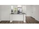 Bright kitchen features stainless steel appliances and a granite island at 9712 Transplanter Cir, Ladson, SC 29456