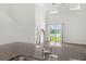 Kitchen island with a view of the backyard and pond at 9712 Transplanter Cir, Ladson, SC 29456