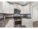 Updated kitchen with white cabinets and stainless steel appliances at 9712 Transplanter Cir, Ladson, SC 29456