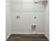 Laundry room boasts gray flooring and connections for laundry machines at 9712 Transplanter Cir, Ladson, SC 29456