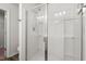 Modern glass enclosed shower with updated showerhead, seating and tiled surround at 9712 Transplanter Cir, Ladson, SC 29456